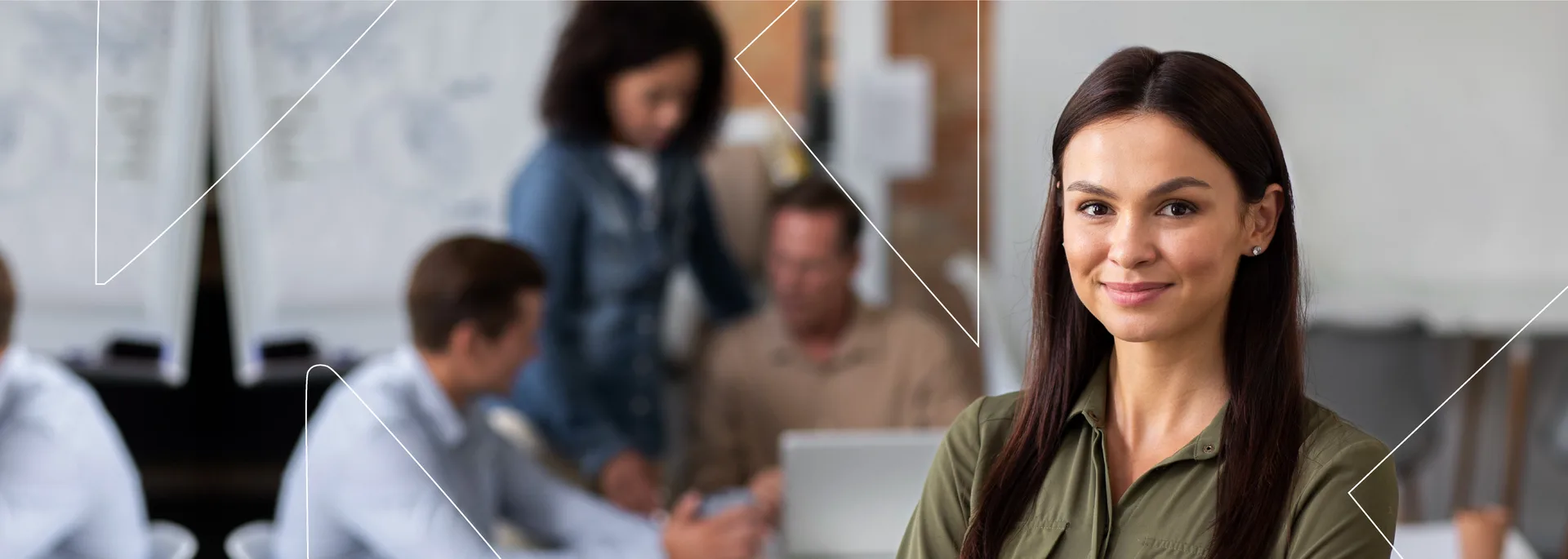 A Kato professional in a supervised office, with her team working behind her